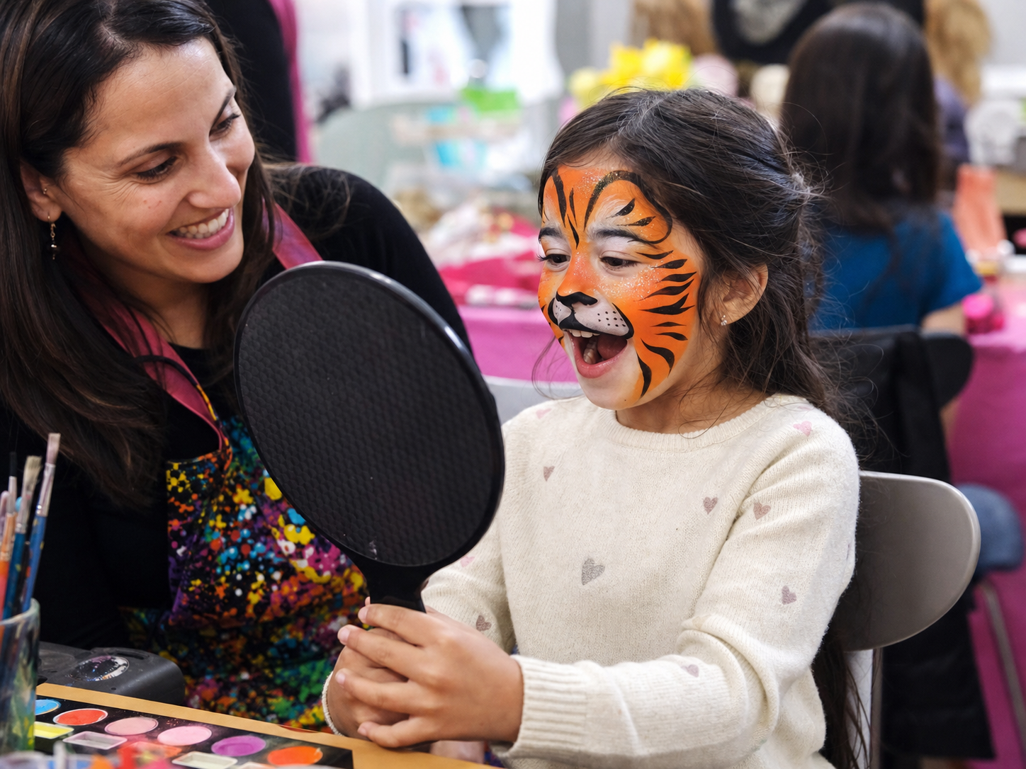 Child seeing a tiger face-painting design