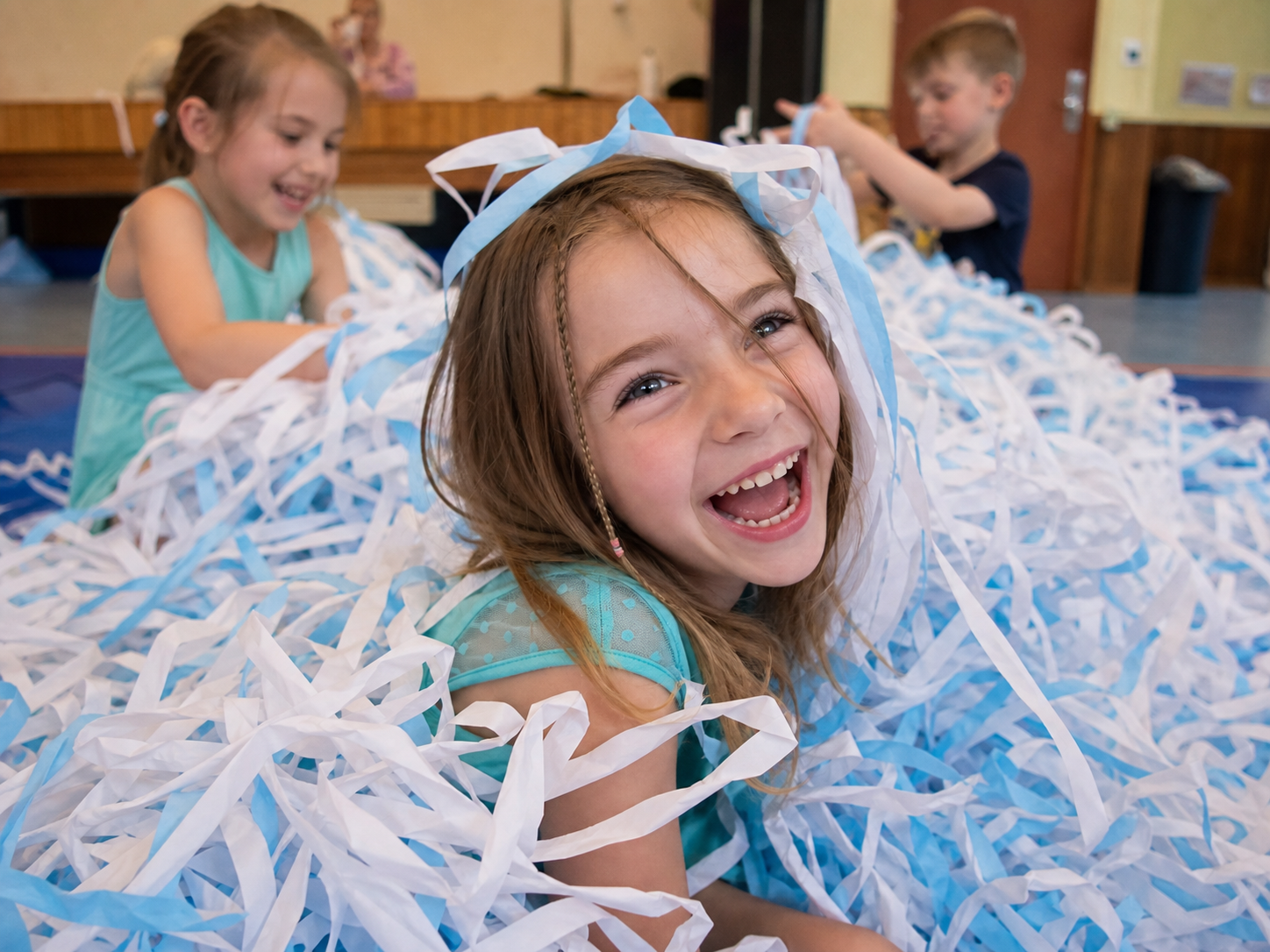 Child laughing during a Paper Show